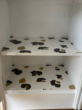Load image into Gallery viewer, Pair of cane webbing panel bedside cabinets, lined with Black and white snow leopard!