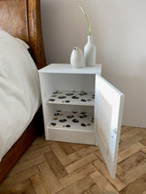 Load image into Gallery viewer, Pair of cane webbing panel bedside cabinets, lined with Black and white snow leopard!
