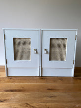 Load image into Gallery viewer, Pair of cane webbing panel bedside cabinets, lined with Black and white snow leopard!
